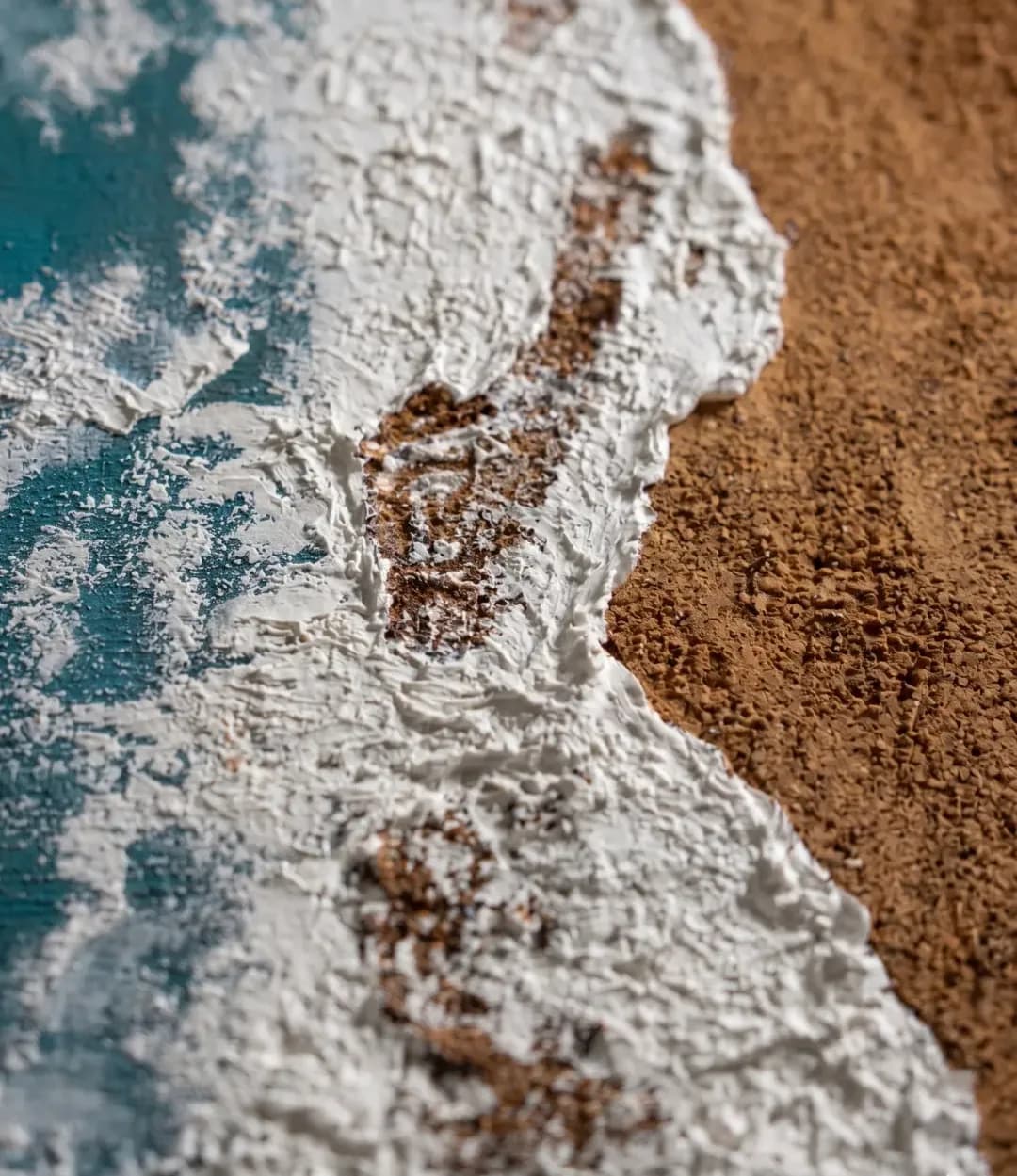 Close-up of Coastline: palette-knife texture of white surf breaking over sand-brown paint